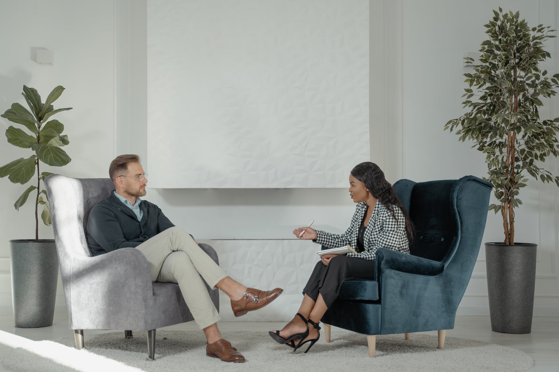 a psychologist talking to her patient