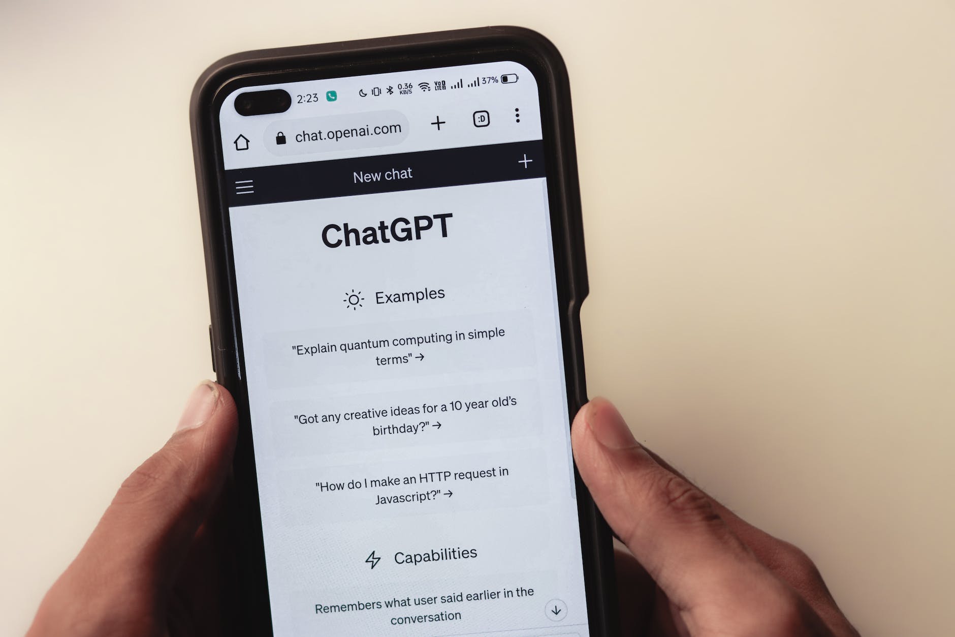 webpage of chatgpt a prototype ai chatbot is seen on the website of openai on a smartphone examples capabilities and limitations are shown